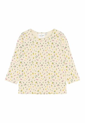 Kremowy top z rękawami o długości 3/4, zdobiony kwiatowym wzorem w odcieniach różu i żółci na prążkowanej teksturze. Okrągły dekolt oraz luźny krój.