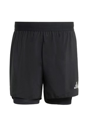 Schwarze Sportshorts mit einer lockeren Außenschicht und enganliegenden Innenshorts. Sie zeichnen sich durch eine glatte Textur und ein dezentes reflektierendes Logo an der Seite aus.