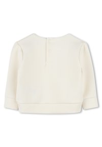 Lichtcrème pullover met lange mouwen, ronde hals en knoopsluiting aan de achterkant. Zachte katoenen stof met een gladde textuur.