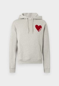 Sweat à capuche gris en tissu doux, avec une poche kangourou, une capuche à cordon de serrage, et un patch cœur rouge portant le mot "FUTURE" en blanc.