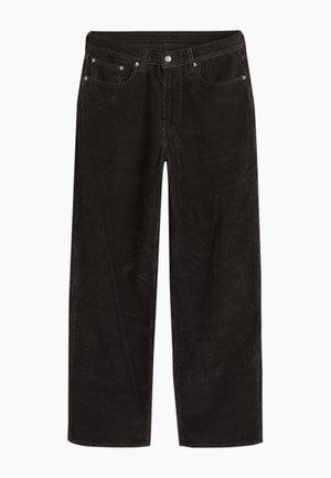 Black corduroy trousers with a wide-leg cut, featuring a zip fly, front pockets, and subtle vertical ribbed texture.