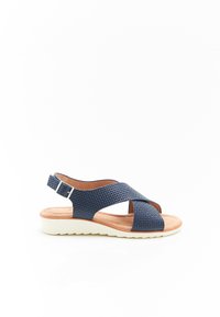 Sandal blu navy con texture intrecciata, cinghie incrociate, fibbia regolabile alla caviglia e suola in gomma bianca. Design piatto e aperto.