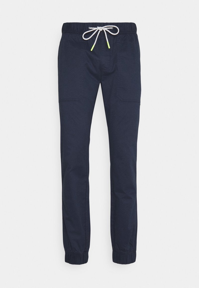 Navyblå byxor i lättviktsmaterial, med elastisk midja och snörning samt elastiska muddar, två sidofickor.