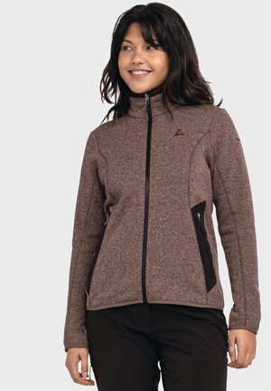 Braune strukturierte Zip-Jacke mit hohem Kragen, schwarzen Akzentpaneelen, Seitentaschen und kontrastierenden Nähten.