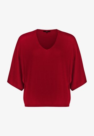 Top rosso a maniche corte in maglia con scollo a V e vestibilità ampia, caratterizzato da un orlo a coste e senza motivi o decorazioni visibili.