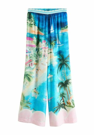 Laiad püksid, millel on elav troopiline muster siniste, roheliste ja roosade toonidega, kujutades palmipuid, purjekaid ja rannamaastikke.