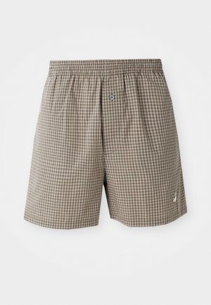 Bruna rutiga shorts med midjeband i elastik, sidelommer och en liten logodetalj nära fållen. Lättviktig tyg.