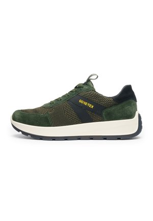 Green and black sneaker with knit and suede textures, white sole, black outsole, GORE-TEX label on side, and pull tab on tongue.