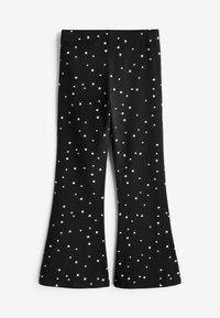 Zwarte uitlopende broek met witte sterrenprint overal. Elastische tailleband, zachte stof en een gladde textuur. Geen zakken of extra versieringen.