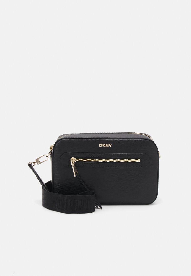 Black DKNY crossbody bag made of textured material, featuring a gold zipper detail, logo on the front, and a detachable strap.