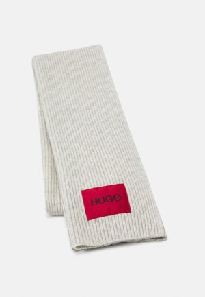 Light gray ribbed knit scarf folded, featuring a red rectangular patch with black "HUGO" text near one end.