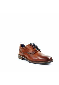 Braune Lederdressschuhe mit abgerundetem Zehenbereich, schwarzen Schnürsenkeln und strukturiertem Seitenpaneel. Mit einer kontrastierenden Holzsohle.