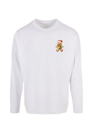 Long-sleeve white shirt featuring a small graphic of a gingerbread man with a red hat and green scarf on the upper left chest area.