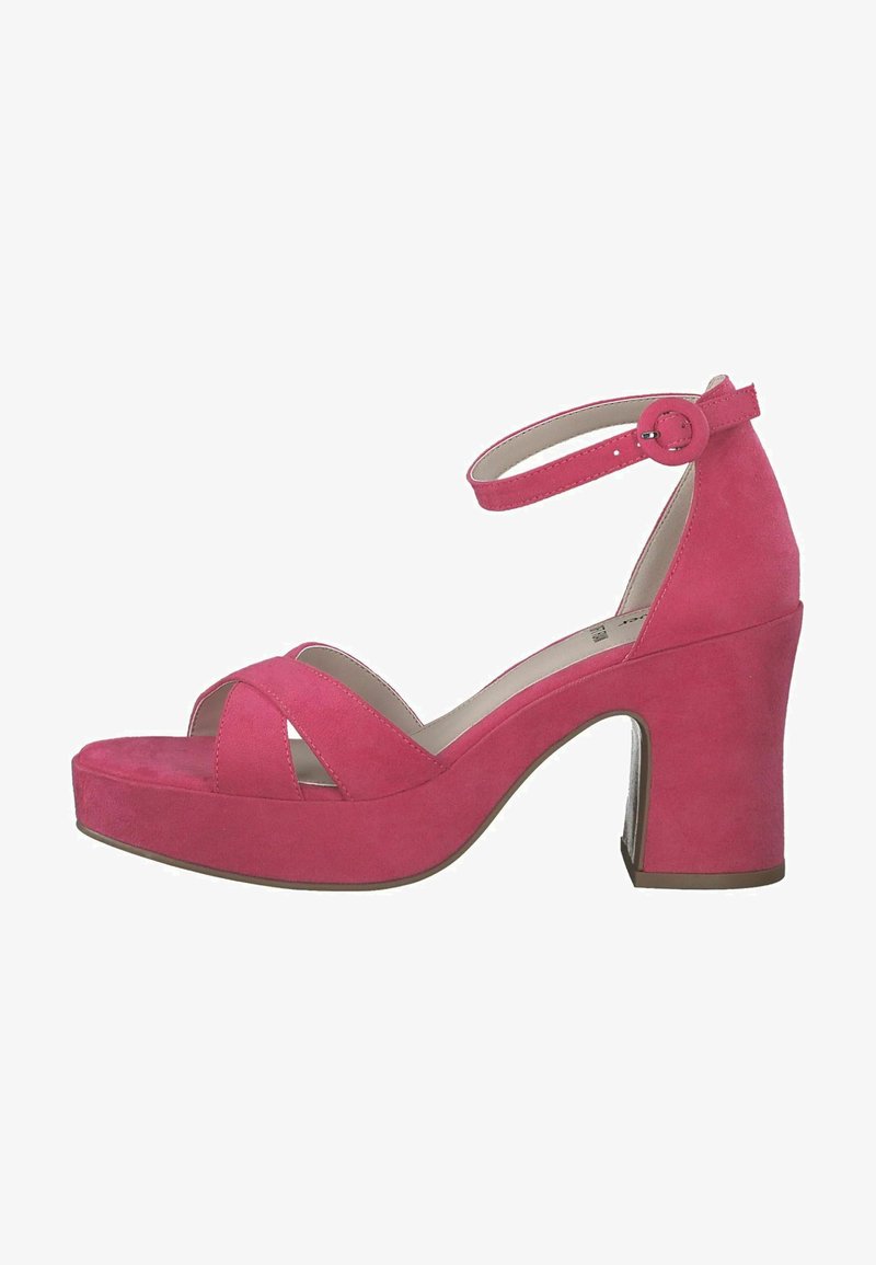 Pink suede high-heeled sandals with an ankle strap, featuring crossed front straps, a thick block heel, and a platform sole.