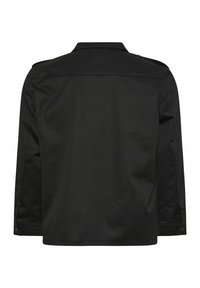 Veste noire à manches longues avec col, poignets boutonnés et couture droite dans le dos, vue de dos sur fond blanc.