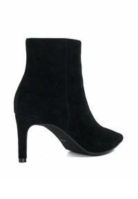 Black suede ankle boot with pointed toe and high stiletto heel. Smooth texture, seamless design, and minimalistic silhouette.