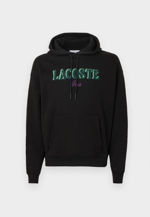 Felpa con cappuccio nera con tasca a marsupio frontale, presenta il logo "LACOSTE Paris" ricamato in verde e viola, cappuccio con coulisse e polsini a costine.