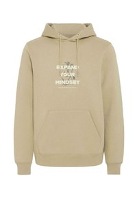 Sudadera beige con capucha, bolsillo frontal y cordón. Presenta el texto "EXPANDE TU MENTE" impreso en blanco. Textura de tela suave.