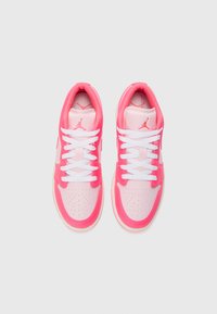 Pink and white athletic shoes with a smooth leather upper, perforated toe box, padded collar, and white laces. Logo accent on the tongue.