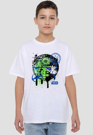 White short-sleeve t-shirt featuring a graphic print with green, blue, and black splatter design, including the "Star Wars" logo.