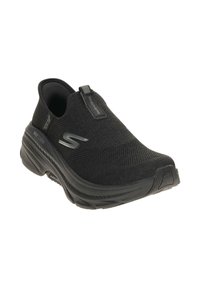 Schwarze Slipper-Sneaker aus atmungsaktivem Mesh-Gewebe mit einer gepolsterten Sohle, abgerundeter Spitze und dezentem Logodetail an der Seite.