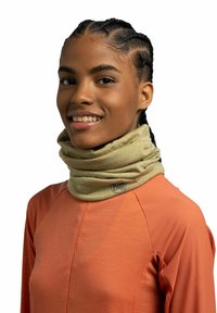 Beige neck gaiter made from a soft material, featuring a subtle pattern and a logo. Worn with an orange textured athletic top.