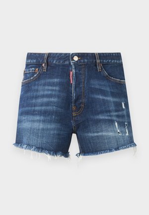 Tumši zilas džinsa šorti ar saplēstām malām, nodilušām detaļām labajā kājā, priekšējā pogu, rāvējslēdzēju un piecām kabatām.