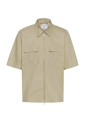 Kratek rokav, svetlo bež jakna iz gladkega materiala, z zadrgo na sprednji strani, koničastim ovratnikom in dvema prsnikoma.