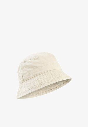 Beżowy bawełniany kapelusz typu bucket z przeszyciami i opuszczanym rondem.
