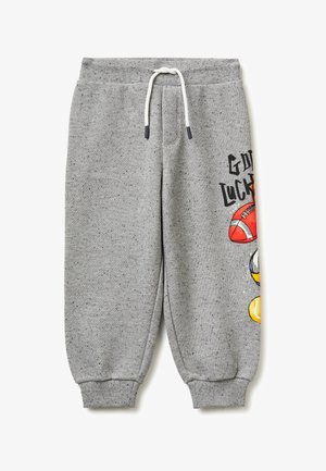 Pantaloni della tuta a pois grigi con coulisse bianca, polsini a costine e grafica sportiva parziale con pallone da football e testo "Buona fortuna" sulla gamba destra.