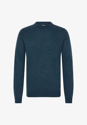 Pull en tricot bleu marine, à manches longues, avec un col rond, des poignets et un ourlet côtelés, arborant un petit logo près du bas.