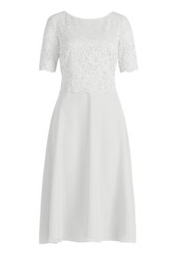 White dress with a sheer lace top and short sleeves; A-line silhouette; smooth, flowing fabric; scalloped lace edges.