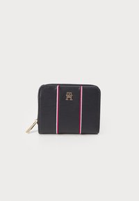 Black leather wallet with a zip closure, featuring red and white vertical stripes and a gold logo on the front.