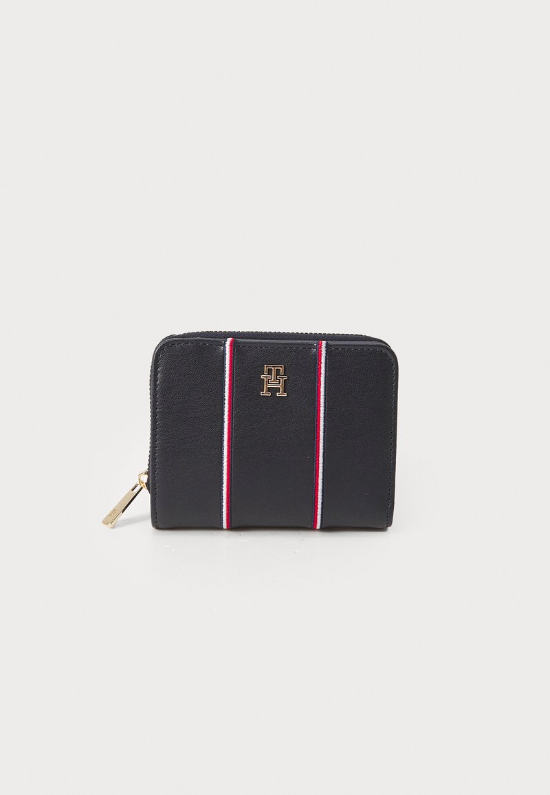 Black leather wallet with a zip closure, featuring red and white vertical stripes and a gold logo on the front.