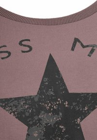 Pink cotton sweatshirt featuring a large black star design and distressed text. The neckline is ribbed for added texture.