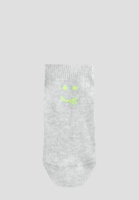 Chaussette grise à côtes présentant un motif de visage souriant vert. La chaussette a une texture douce et un design standard à coupe basse.