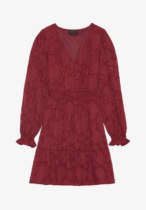Red dress with floral texture, V-neck, long sleeves with ruffled cuffs, elastic waistband, and tiered skirt design. Cotton-blend fabric.