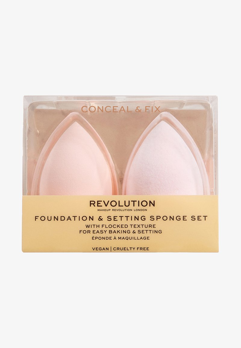 Foundation- und Setting-Schwamm-Set, bestehend aus zwei Schwämmen in hellrosa mit einer flauschigen Textur, verpackt in einem klaren Plastikgehäuse.
