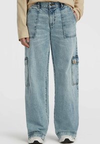 Light blue denim cargo pants with a loose fit, featuring large side pockets, a button closure, and subtle whiskering details.