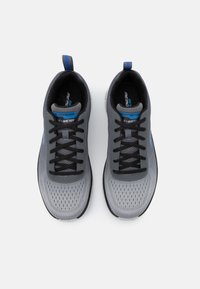 Gray athletic shoes with black laces, mesh upper, blue accents, padded collar, and lightweight design. Suitable for active wear.