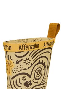 Żółte wiaderko dla dzieci z czarnymi wzorami w stylu kreskówkowym, ozdobione gumowym akcentem w kształcie tygrysa oraz teksturowanym żółtym uchwytem z napisem "Affenzahn".