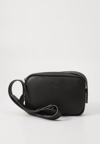 Black leather crossbody bag with a rectangular shape, zip closure, adjustable strap, and subtle branding on the front.