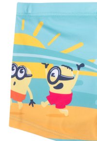 Costumi da bagno con una stampa colorata di personaggi dei cartoon su uno sfondo di spiaggia blu e gialla, con tonalità vivaci e una texture liscia.