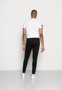 Antony Morato TROUSERS SUPER  - Calças de fato de treino - black