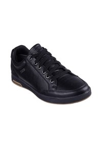 Sneaker in pelle nera con punta rotonda, design con allacciatura, occhielli in argento e dettagli texture. Presenta una suola in gomma con rifiniture marroni chiaro.