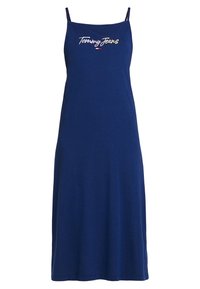 Granatowa sukienka na ramiączkach o luźnym kroju, z cienkimi paskami na ramionach i kolorowym haftowanym logo "Tommy Jeans" na przodzie.