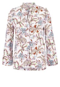Blumenbluse mit langen Ärmeln, die einen weißen Hintergrund, aufwendige mehrfarbige Blumenmuster und ein Schlüssel-ausschnitt-Detail aufweist.