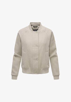 Kremowa kurtka bombowca z prążkowanym kołnierzem, z przodu na guziki, z bocznymi kieszeniami i teksturowanymi akcentami na rękawach. Wykonana z miękkiego materiału.