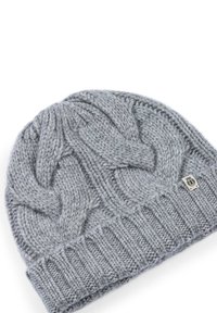 Gray knitted beanie with a cable pattern, textured surface, and ribbed cuff. Features a small branded tag on the side.