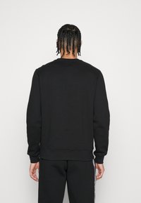 Lacoste Sport TAPERED - Sweatshirt - black